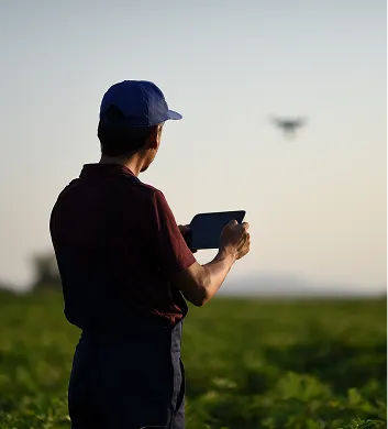 Agronomist reviewing a tablet in a field